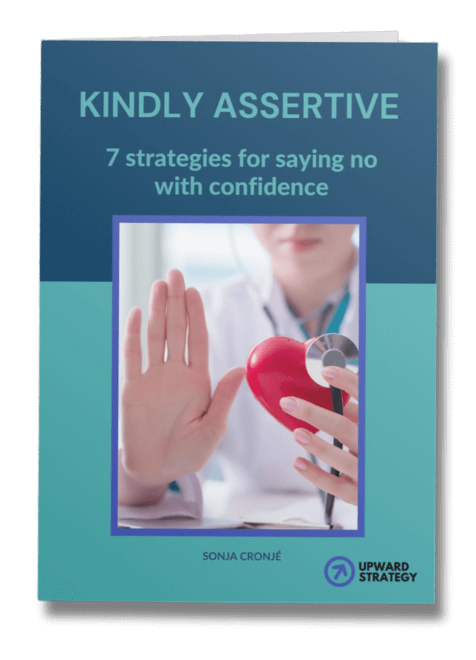 Book cover titled "Kindly Assertive: 7 Strategies for Saying No with Confidence" by Sonja Cronjé. It features an image of a person with an outstretched hand, holding a red heart object—a nod to well-being and learning to set boundaries compassionately.